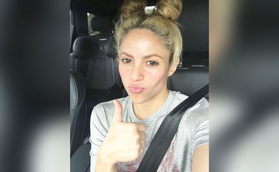 Shakira takes a selfie in her car. 