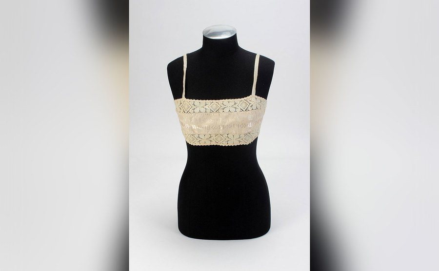 A silk and lace bandeau top is on display. 