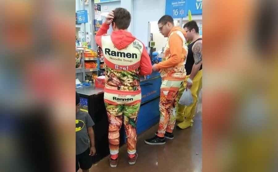 Two men shop in matching ramen-themed tracksuits. 