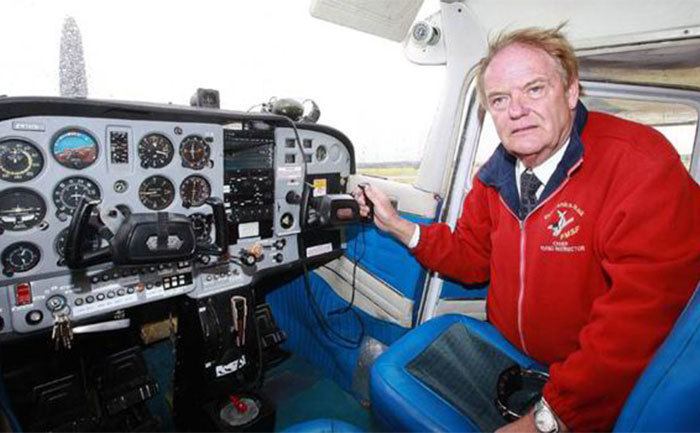 Roy Murray explains the controls from inside the cockpit. 